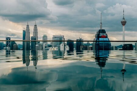 Nov 2018. Petronas Twin towers seen from skyscrapper's roof with pool, Kuala Lumpur central park, KLCCのeditorial素材