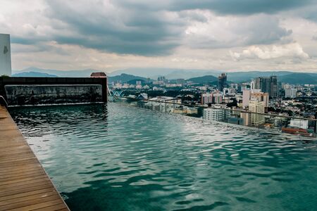 Nov 2018. Petronas Twin towers seen from skyscrapper's roof with pool, Kuala Lumpur central park, KLCCのeditorial素材