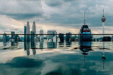 Nov 2018. Petronas Twin towers seen from skyscrapper's roof with pool, Kuala Lumpur central park, KLCCのeditorial素材