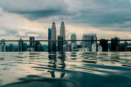 Nov 2018. Petronas Twin towers seen from skyscrapper's roof with pool, Kuala Lumpur central park, KLCCのeditorial素材
