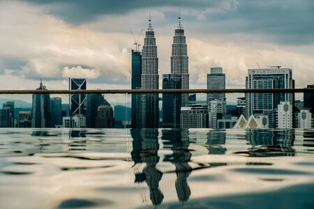Nov 2018. Petronas Twin towers seen from skyscrapper's roof with pool, Kuala Lumpur central park, KLCCのeditorial素材