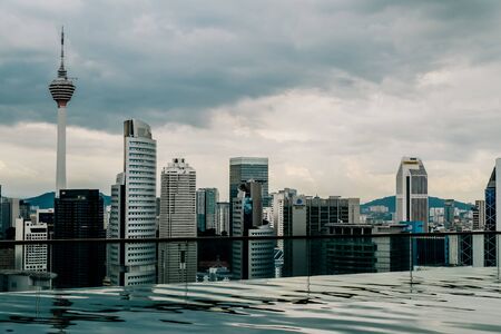 Nov 2018. Petronas Twin towers seen from skyscrapper's roof with pool, Kuala Lumpur central park, KLCCのeditorial素材