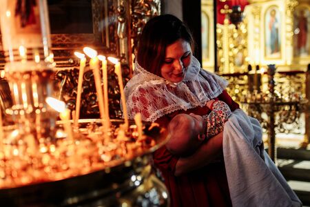 Dec 2018, Mother and child in church looking at candlesのeditorial素材