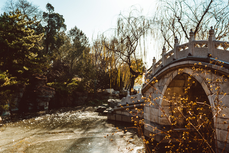 Stone arch bridge in Yunnan Ethnic Minority Village. Stone arch bridge in the parkの写真素材