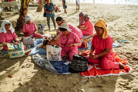 Bohol Island, Philippines- 5/11/2016 Tourists were enjoying massage service under a palm tree on the beach.Massage business was a common business on the beach in Mindoro Island.のeditorial素材