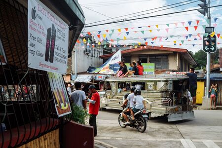 Puerto Galera, Philippines - Nov, 2016: Jeepney staying to pick up passengers, crossroad, day timeのeditorial素材