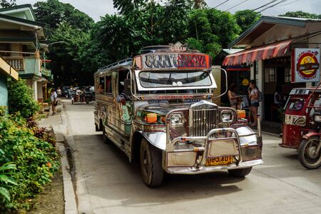 Puerto Galera, Philippines - Nov, 2016: Jeepney staying to pick up passengers, crossroad, day timeのeditorial素材