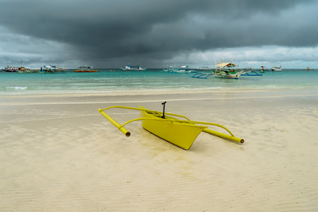 Yelow boat in the sea with clouds and blue sky at Boracay Island, Philippines. For nature background.の写真素材