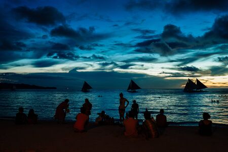 BORACAY PHILIPPINES - Nov 17, 2017: Unknown people on beautiful White beach of Boracay Island in sunsetのeditorial素材