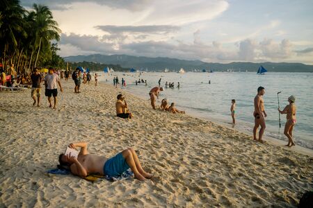 BORACAY PHILIPPINES - Nov 17, 2017: Unknown people on beautiful White beach of Boracay Island in sunsetのeditorial素材