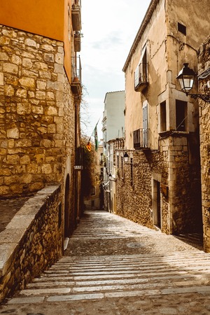 Narrow street in old town. Girona, Catalonia, Spainの写真素材
