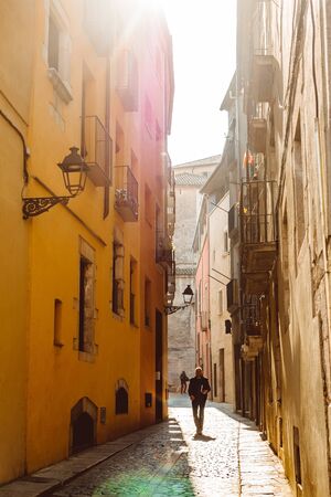 Girona, Spain - February, 2019: Narrow street in old town. Girona, Catalonia, Spainのeditorial素材