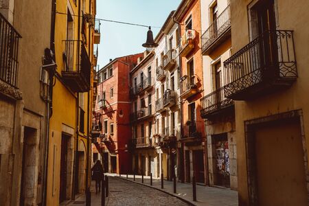 Girona, Spain - February, 2019: Narrow street in old town. Girona, Catalonia, Spainのeditorial素材