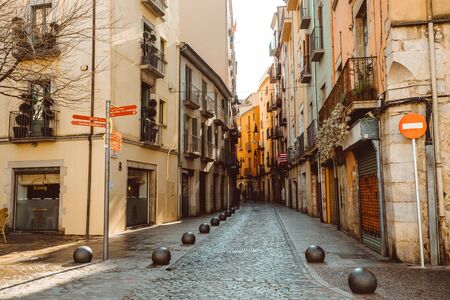 Girona, Spain - February, 2019: Narrow street in old town. Girona, Catalonia, Spainのeditorial素材
