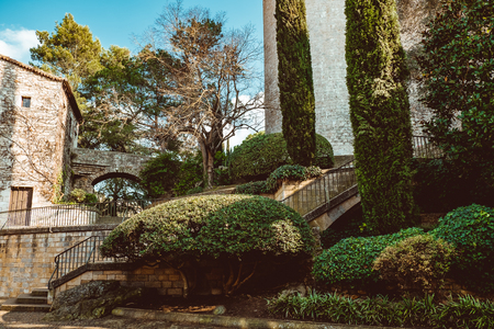 Bridges across the former moat in the park of the old city in Girona, Spain, medieval beauty.の写真素材