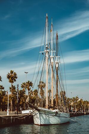 Port of Barcelona, Spain. Yachts, sailing boats and old big tower/ Feb 2019のeditorial素材