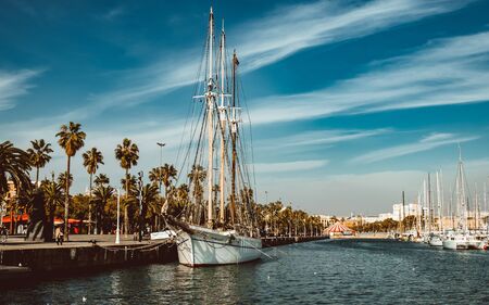 Port of Barcelona, Spain. Yachts, sailing boats and old big tower/ Feb 2019のeditorial素材