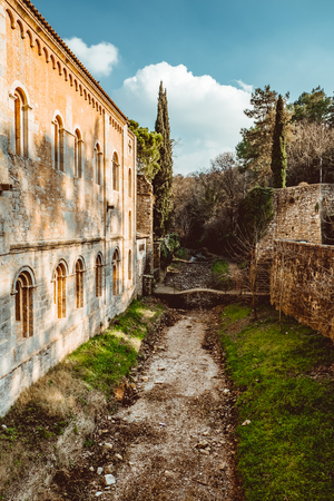 Bridges across the former moat in the park of the old city in Girona, Spain, medieval beauty.の写真素材