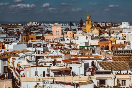 Seville, Spain, February 2019: beautiful view of street in city center with historic buildings and old architecture, aerial view, dramatic sky. Seville, Andalusia, Spainのeditorial素材