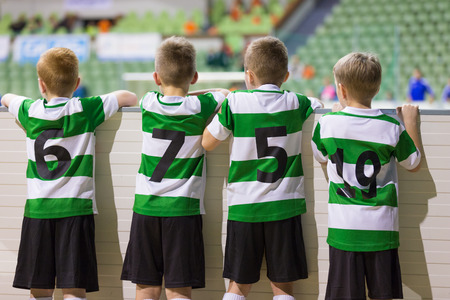 Youth sport football team players support teammates on the sports school competitionの写真素材
