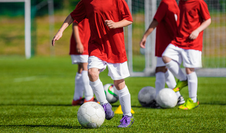 Boys Training Soccer on the Soccer Field. Children Football Training Sessionの写真素材