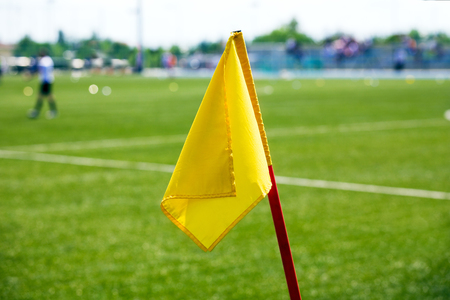 Yellow Soccer Corner Flag. Football Stadium in the Backgroundの写真素材