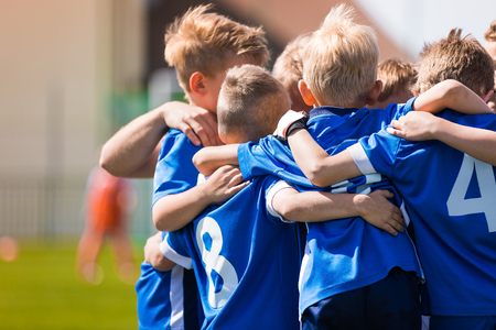 Kids Play Sports. Children Sports Team United Ready to Play Game. Children Team Sport. Youth Sports For Children. Boys in Sports Uniforms. Young Boys in Soccer Sportswearの写真素材