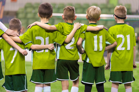 Youth Junior Soccer Team. Boys Standing in a Row and Watching Penalty Kicks During Extra Timeの写真素材