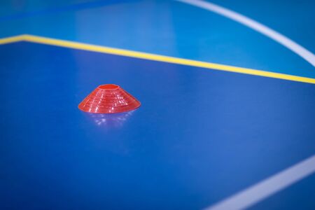 Soccer Indoor Marker on Pitch Sideline. Yellow Soccer Cone Marker