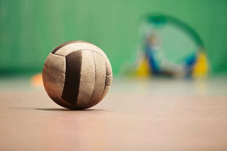 Vintage Retro Soccer Ball on WOoden Floor. Old School Football Futsal Ball. Indoor Soccer Training Equipmentの写真素材