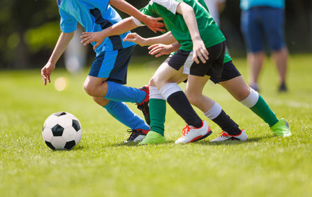 Sports Skills Training Session. Players Training on the Field. Soccer Obstacle Course. Grass Football Field. Coaching Soccer Gear Equipment for Field Trainingの写真素材