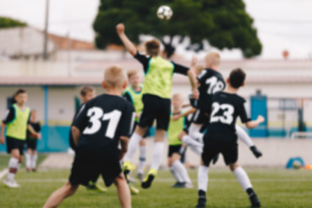 Children Playing Soccer â Youth Football Training and Match on Outdoor Field. Kids Soccer Practice, Sports Education, and Team Developmentの写真素材