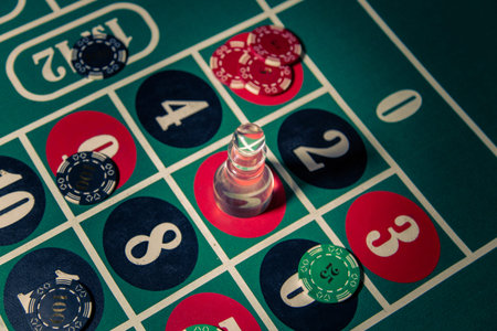 Casino chips placed on a roulette table with a dolly marking the winning number show the atmosphere...