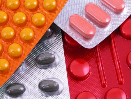various pills - yellow red grey close-ups