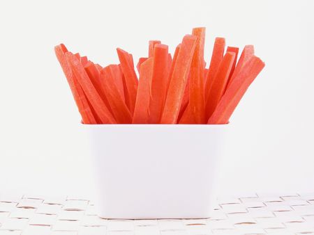 fresh carrots in white bowlの写真素材