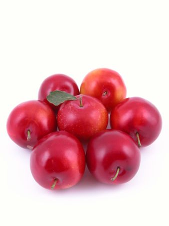 sweet red plums isolated on whiteの写真素材