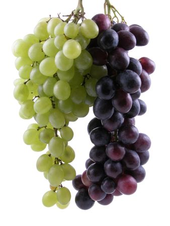 bunch of dark and white grapes isolated on whiteの写真素材