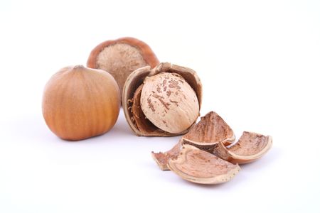 three hazelnuts isolated on white