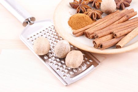 close-ups of aromatic spices - cinnamon nutmegs and aniseの写真素材