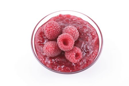 bowl of raspberry jam and some fresh berry isolated on white