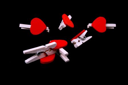 little wooden hearts on black backgroundの写真素材