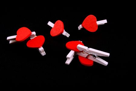 little wooden hearts on black backgroundの写真素材