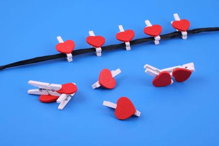 little wooden hearts on blue backgroundの写真素材