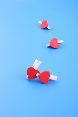 little wooden hearts on blue backgroundの写真素材