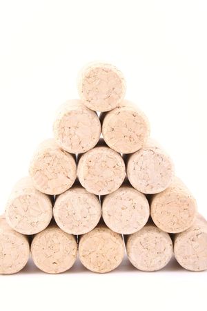 pile of wine corks close-ups isolated on whiteの写真素材