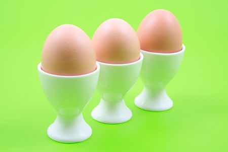three eggs on green backgroundの写真素材