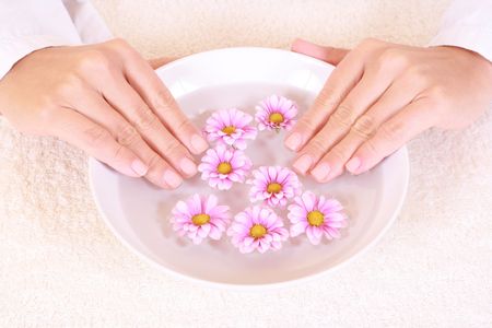 bowl of pure water and spring flowers - beauty treatmentの写真素材