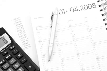 year planner - calculator pen and calendar - financeの写真素材