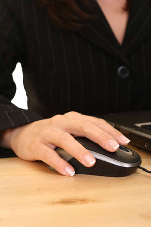 close-ups of mouse and woman hand - computer workの写真素材