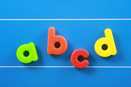 colorful letters on blue board - education conceptの写真素材